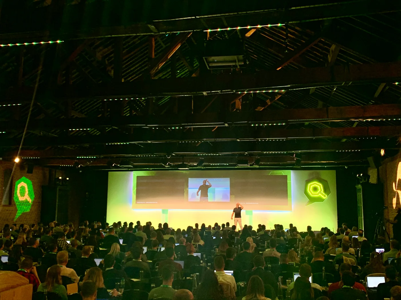 Conference speaker and audience — example photograph, not Jah Noah